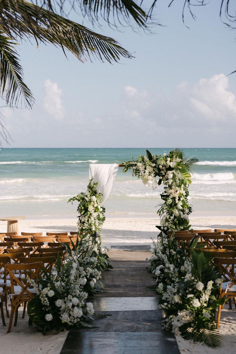 Floral aisle by the sea · Tulum