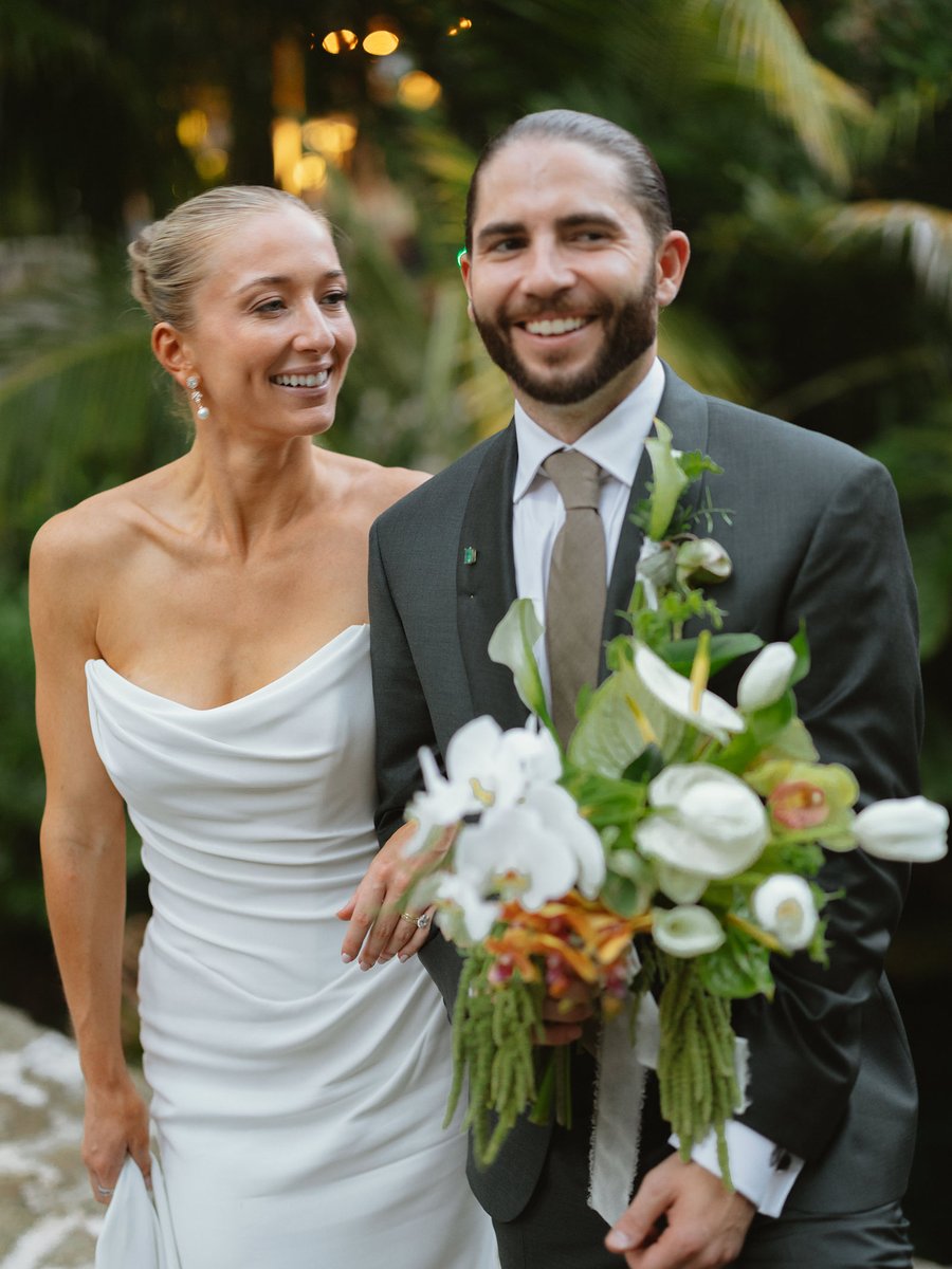Newlyweds smiling in the jungle in Tulum