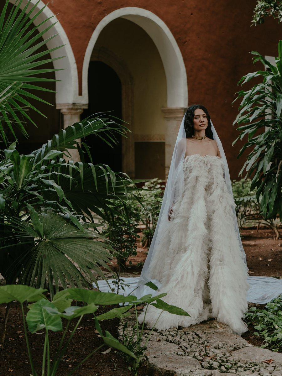 Bride under the arches of a hacienda in Yucatán