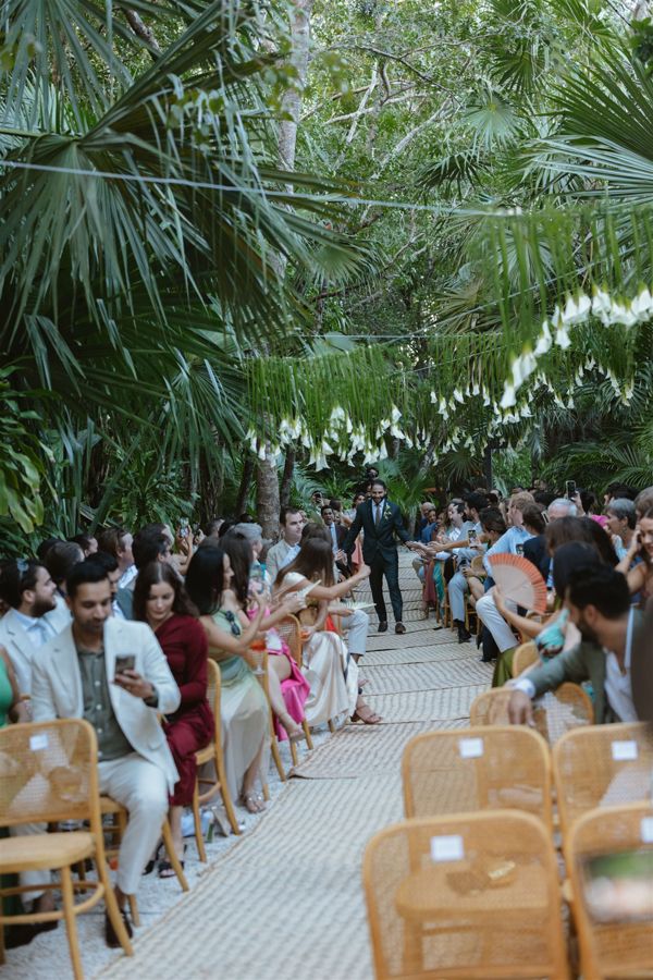 Kelly & Quino's guests along the jungle aisle at Vesica