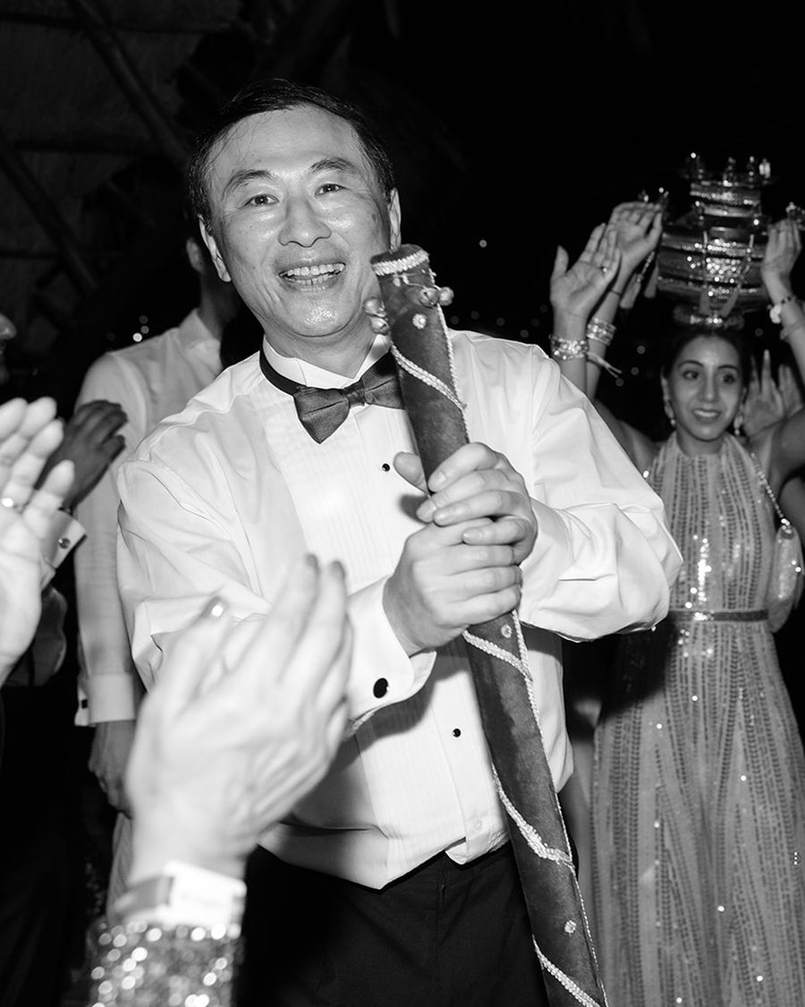Groom and guests on a crowded dance floor