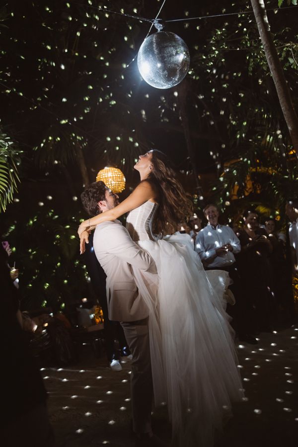 Allie & Ryan dancing under the disco ball in the jungle